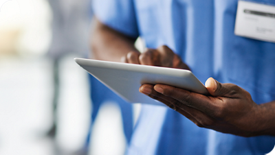 nurse holding an ipad