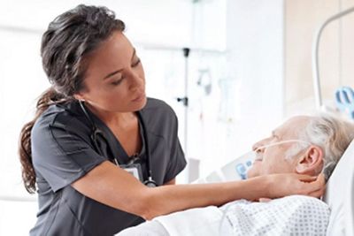 Caregiver tending to patient