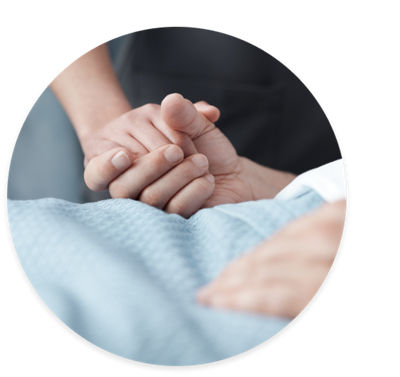 Caregiver holding patient’s hand