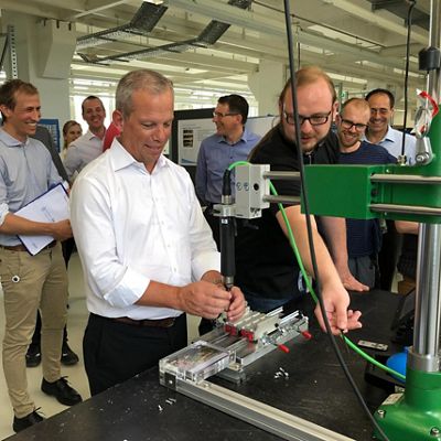 John P. Groetelaars touring a production facility with Hillrom team members