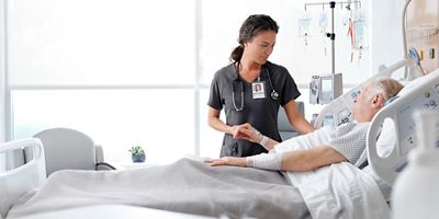 caregiver bedside with a patient