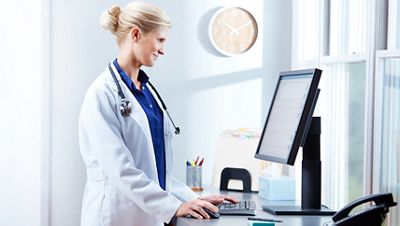 doctor reviewing data on a monitor