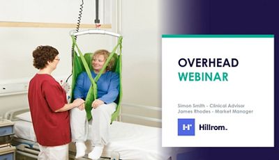 Close-up of doctor using tablet device in hospital hallway