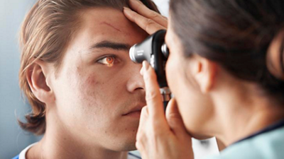  Welch Allyn PanOptic Plus Ophthalmoscope side view in application