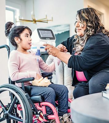 Patient using the Volara™ System, an Oscillation & Lung Expansion device, at home.