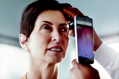  Welch Allyn PanOptic Plus Ophthalmoscope side view in application