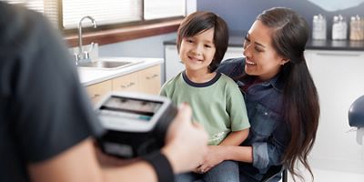 Child having vision screened with the Welch Allyn Spot Vision Screener.