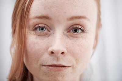 Beautiful young woman looking at camera