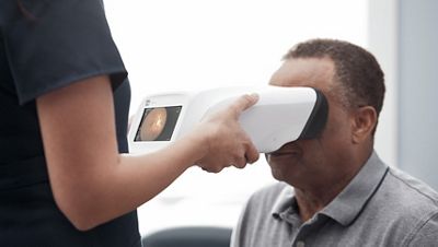 Patient receiving diabetic retinal exam