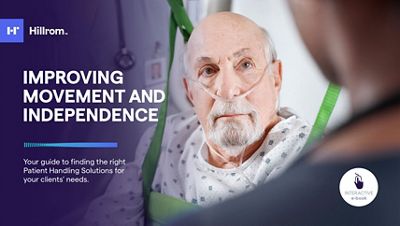 Close-up of doctor using tablet device in hospital hallway