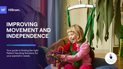 Close-up of doctor using tablet device in hospital hallway