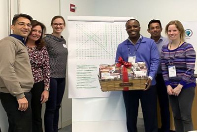 A group of Hillrom leadership trainees receives a prize after their presentation