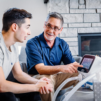volara system: old therapy for home care being shown the device to a patient in the living room